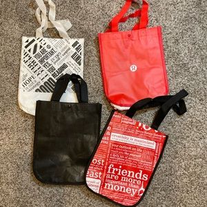 4 Lululemon bags. Red, white, black.
